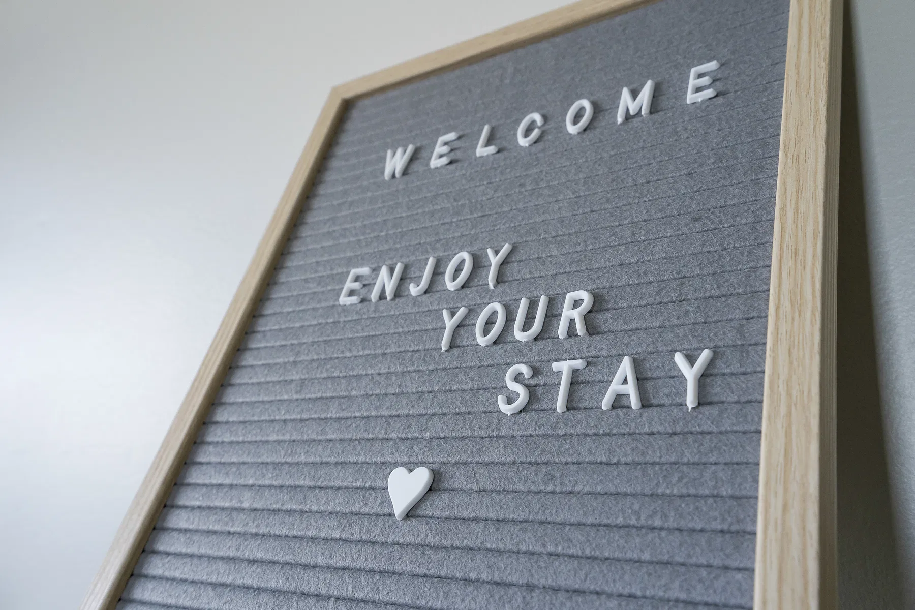 Welcome letterboard inviting guests to enjoy their stay