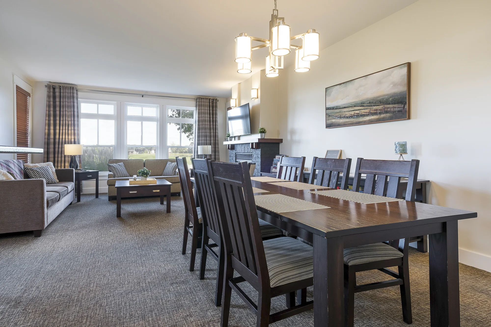 Dining area with table for six beside the living room