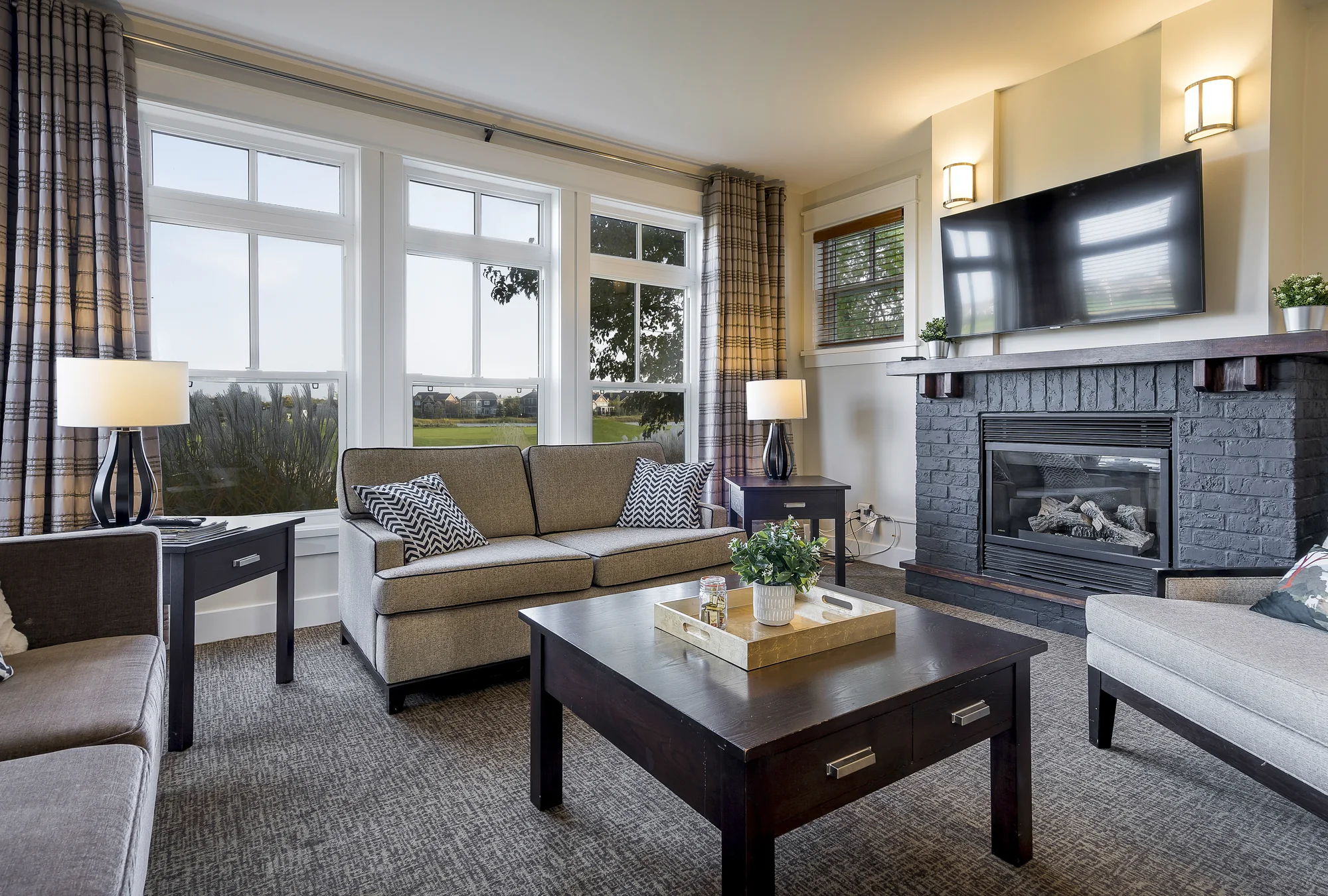 Bright living room with gas fireplace and comfortable seating