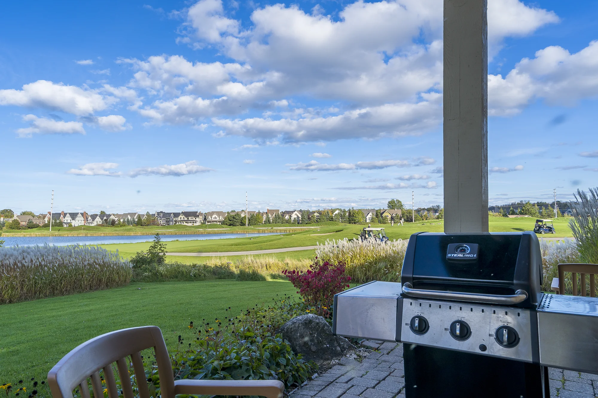 Private patio with outdoor dining and gas barbecue